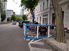 A parklet in Bratislava with outdoor seating of a cafe. Parklet in Bratislava by Marina cafe.jpg
