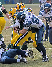 Green Bay quarterback Aaron Rodgers being sacked by Seattle defensive end Patrick Kerney in 2009. Patrick Kerney sacks Aaron Rodgers.jpg