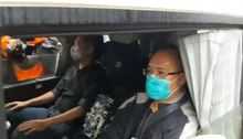 The person seated in the middle is one of two escorted to face the charge of murder at the Tuen Mun Magistrates' Court on 22 April 2020. People arrsted related to the crime in Sheung Shui 20200422.png