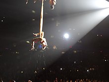 Pink performing "Glitter in the Air" at her The Truth About Love Tour, similar to her 52nd Grammy Awards performance. Pink live Truth About Love Tour Glitter in the Air.jpg