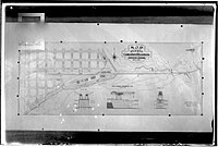 Mapa de la proyección del puerto Antonio Morán conectado profundamente al ferrocarril. Nótese el empalme de la vía al puerto en línea recta a la estación de trenes.