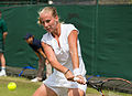 Richèl Hogenkamp competing in the third round of the 2015 Wimbledon Qualifying Tournament at the Bank of England Sports Grounds in Roehampton, England. The winners of three rounds of competition qualify for the main draw of Wimbledon the following week.