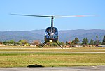 Robinson R22 Helicopter hovering.jpg