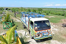 A SOIL truck delivering buckets of human excreta from mobile household UDDTs to the SOIL composting facility in Port-au-Prince, Haiti SOIL Poopmobile delivering buckets of waste to the SOIL composting facility in Port-au-Prince.jpg