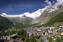 View on the village of Saas-Fee in summer with the mountain panorama in the background.