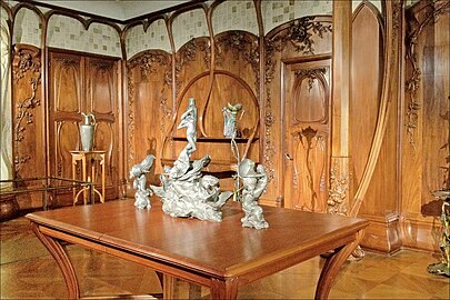 Salon by Alexandre Charpentier combining carved woodwork, furniture and sculpture into a unified work of art (1901) (Musée d'Orsay)