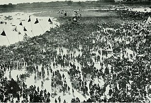 A photo (c. 1909) by Ada Lee. It shows a Hindu pilgrim gathering at a Magha Mela at Ganga Sagar, West Bengal - where river Ganges meets the Bay of Bengal. Scenes from every land, second series; a collection of 250 illustrations picturing the people, natural phenomena, and animal life in all parts of the world. With one map and a bibliography of (14580412870).jpg