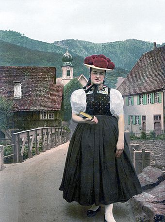 An unmarried Black Forest woman wearing a red Bollenhut, 1898