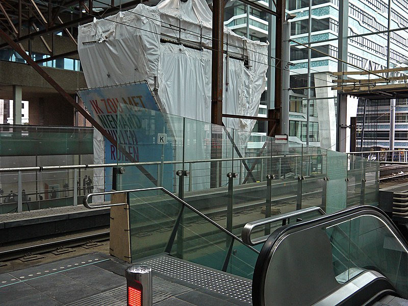 File:See-through from the interior of Central Station The Hague, tram platform with escalator; high resolution image by FotoDutch, June 2013.jpg