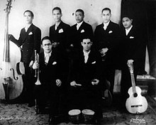 The Septeto Puerto Rico in the early 1930s. Guillermo "Piliche" Ayala is standing on the right with the first known Puerto Rican tres. Septeto Puerto Rico.jpg