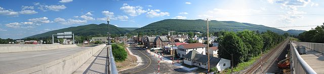 A panoramic view of South Williamsport from the Carl E. Stotz Memorial Little League Bridge with Bald Eagle Mountain in the background