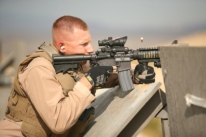 File:Special Reaction Team member, Provost Marshall's Office, Headquarters Battalion, Marine Corps Air Ground Combat Center, fires M-4 service rifle during a training excercise.jpg