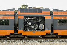 "PowerPack" car of a diesel Flirt with open compartment of diesel-generator Stadler Flirt DMU 2404 power car.jpg