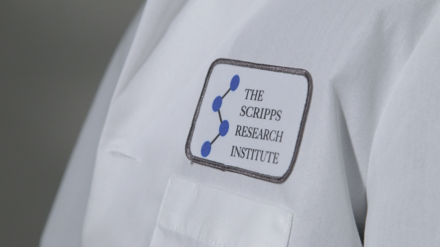 A lab coat with a The Scripps Research Institute patch