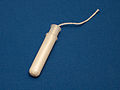 Tampon with plastic applicator
