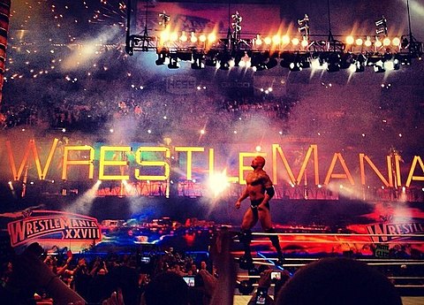 The Rock celebrating his victory at WrestleMania XXVIII, April 2012