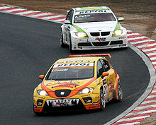 Coronel driving the SEAT Leon TFSI in the second race at the 2008 WTCC Race of Japan in Okayama. He managed to hold off a charging Augusto Farfus and won his first WTCC race. Tom Coronel and Augusto Farfus 2008 Japan.jpg