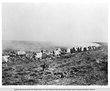 Train of covered wagons on the Santa Fe Trail Train of covered wagons on the Santa Fe Trail.jpg