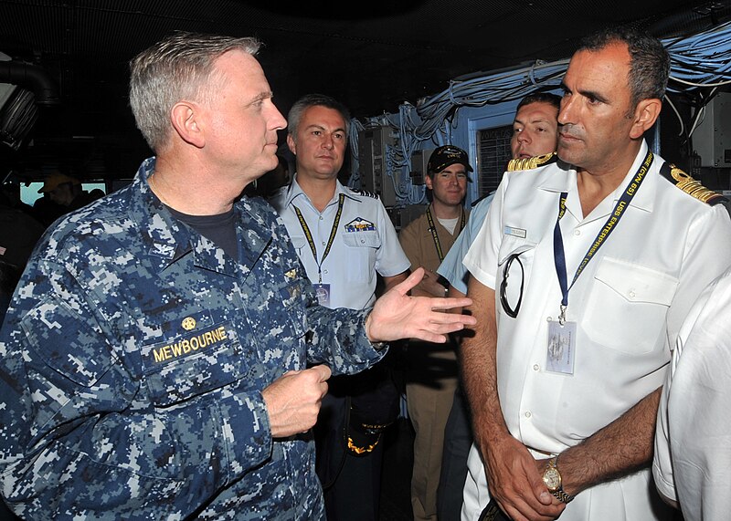 File:US Navy 110625-N-CH661-056 Capt. Dee L. Mewbourne, commanding officer of the aircraft carrier USS Enterprise (CVN 65), talks to military officials.jpg