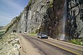 Waterfall coming onto the road (5161866406).jpg