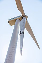 Image 21Workers inspect wind turbine blades (from Wind turbine)