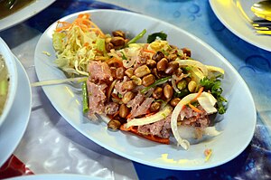 Yam naem, a salad with naem sausage made from raw pork fermented with glutinous rice