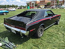 Louvers mounted to the rear window of a 1970 AMC Javelin 1970 AMC Javelin SST with 304 V8 black red C-stripe AMO 2015 meet 2of4.jpg