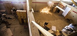 A stun grenade, thrown by soldiers during a training exercise, detonating in a small room 22nd MEU force recon platoon completes advanced combat tactics training 130630-M-HZ646-323.jpg