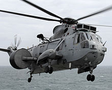 A Sea King AEW 2 Helicopter of 849 Squadron (radar folded) 800 Squadron NSW (Naval Strike Wing), based at RAF Cottesmore, embarked HMS Illustrious for a 6 week deployment. The Sqn were about to commence Exercise Neptune Warrior as part of the cold weather programme for the year. MOD 45147440.jpg