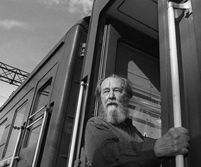 Aleksandr Solzhenitsyn looks out from a train, in Vladivostok, summer 1994, before departing on a journey across Russia. Solzhenitsyn returned to Russ