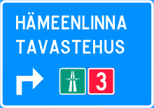 Two names for the same city on a Finnish road sign. Ajokaistan ylapuolinen viitta 631a.svg