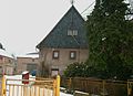 Farm with residential house (upper floor half-timbered, plastered) including attached stable part, barn (in the corner) and enclosure or courtyard wall