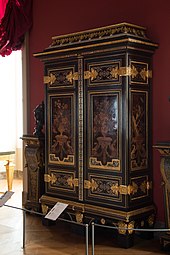 Cupboard; by André Charles Boulle; c.1700; ebony and amaranth veneering, polychrome woods, brass, tin, shell, and horn marquetry on an oak frame, gilt-bronze; 255.5 x 157.5 cm; Louvre[128]