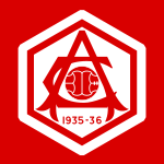 A crest, all in red, of an A overlaid on a C, with a football in the middle.