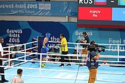 Deutsch: Boxen bei den Olympischen Jugendspielen 2018 Tag 12, 18. Oktober 2018 - Finale im Leichten Weltergewicht Jungen – Ilia Popov (Russland, rot) schlägt Talgat Shaiken (Kasachstan, blau) 4-1; Ringrichter ist James Beckles (Trinidad und Tobago). English: Boxing at the 2018 Summer Youth Olympics on 18 October 2018 – Final Light Welterweight Boys Bout - Ilia Popov (Rusia, rojo) supera a Talgat Shaiken (Kazajstán, azul) 4-1; Referee is James Beckles (Trinidad and Tobago). Español: Boxeo en los Juegos Olímpicos Juveniles de Verano de 2018 en 18 de octubre de 2018 - Chicos de peso welter ligero final: Ilia Popov (Uzbekistán, roja) le gana a Talgat Shaiken (Egipto, azul) 4-1; El árbitro es James Beckles (Trinidad y Tobago).