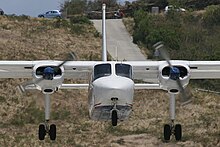 A Windward Express Britten-Norman BN-2 Islander landing at Gustaf III Airport in 2007 Britten-Norman BN-2A-26 Islander, Windward Express Airways JP6108889.jpg