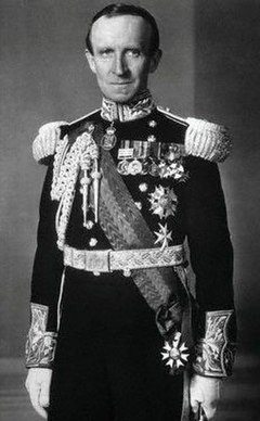 Lord Tweedsmuir, as Governor General of Canada, wearing the Order of the Companions of Honour badge around his neck