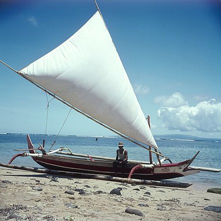 A double-outrigger Indonesian jukung (c. 1970) with a crab claw sail. These were known by the Dutch as vlerkprauw (literally "wing prauw). It is one of the vessels known as "proas" in Island Southeast Asia