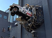 CP24 Breaking News truck on the east wall of the building. CP24 Truck at Queen Street West (20190101114831) (cropped).jpg