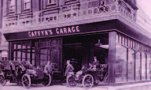 The first garage, at 12 The Colonnade, Eastbourne in 1904. Mr H.B. Caffyn is on the left, Mr P.T. Caffyn in the centre. Caffyns 12 The Colonnade, Eastbourne, 1904.jpg