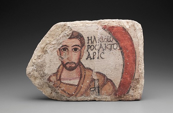 The tile from the ceiling of a House of Scribes that bears a Greek inscription that identifies the man by name, Heliodoros, and occupation, actuarius.