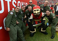 Captain Fear in a photograph with several members of the US Coast Guard at a football game in 2014. Coast Guard conducts flyover for football game 140907-G-RD053-007.jpg