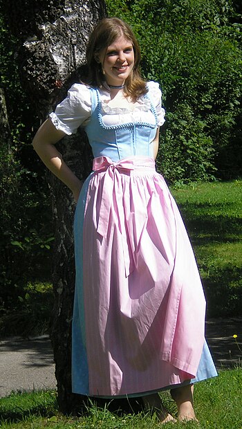 A woman wearing a dirndl. The white part on her body and arms is the blouse.