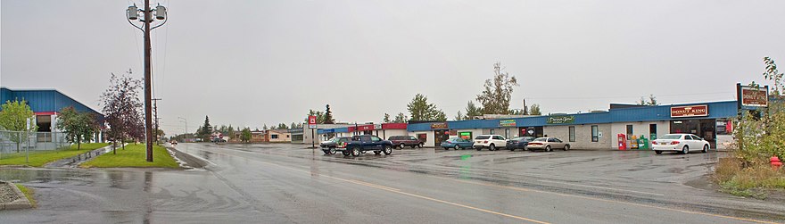 Panoramic view of Main Street looking south as it passes through a smaller business district than what is found along the Parks Highway.