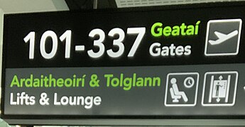 Dublin airport sign in both English and Irish Gaelic languages.jpg