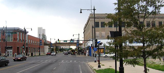 The intersection of 63rd and Halsted, looking south. The Halsted 'L' station can be seen crossing Halsted in the distance. Kennedy–King College occupi