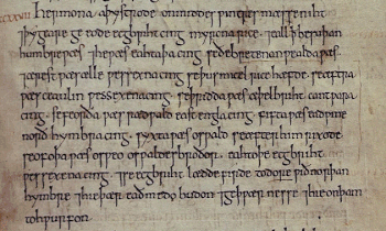 Part of a manuscript page showing eleven lines of lettering in an old style, with a Roman numeral in reddish ink at the start of the first line