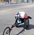 Ernst Van Dyk 10 time men's wheelchair winner in the 2014 Boston Marathon near halfway point in Wellesley Square