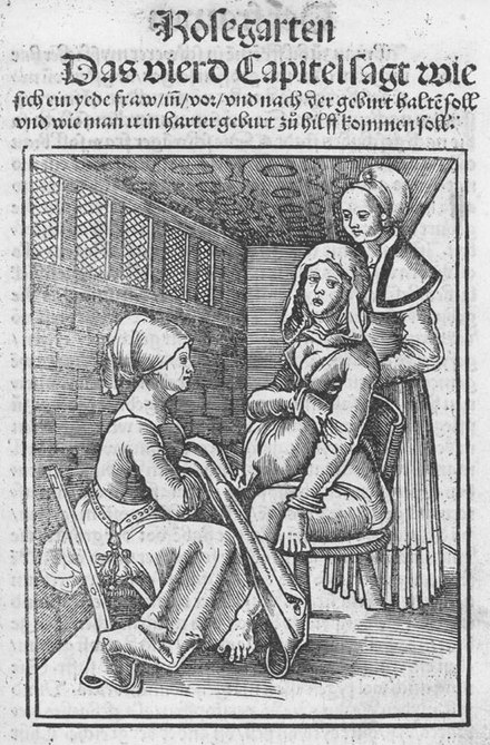 Two midwives assisting a woman in labour on a birthing chair in the 16th century, from a work by Eucharius Rößlin