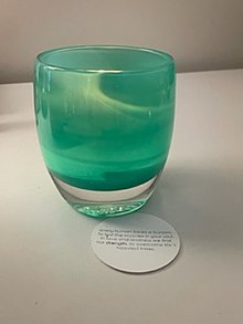 This is the glassybaby votive called "strength" along with the circle card poem behind it. Glassybaby strength.jpg